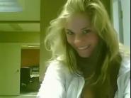 Shy blonde plays on webcam
